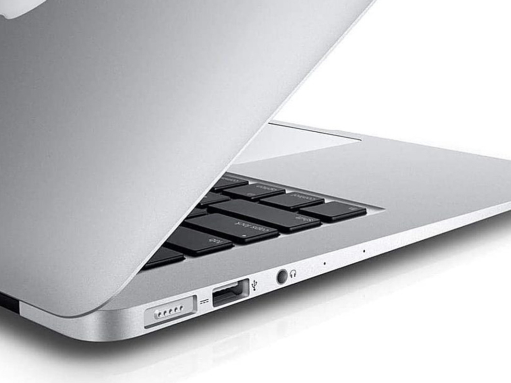 A refurbished MacBook Air on a plain background