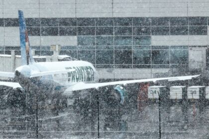 Nearly 500 flights delayed at DIA amid light snow