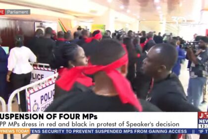 Minority MPs protest suspension of their colleagues in black and red attire