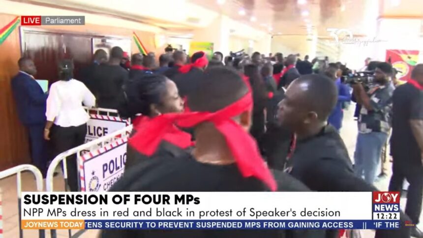 Minority MPs protest suspension of their colleagues in black and red attire