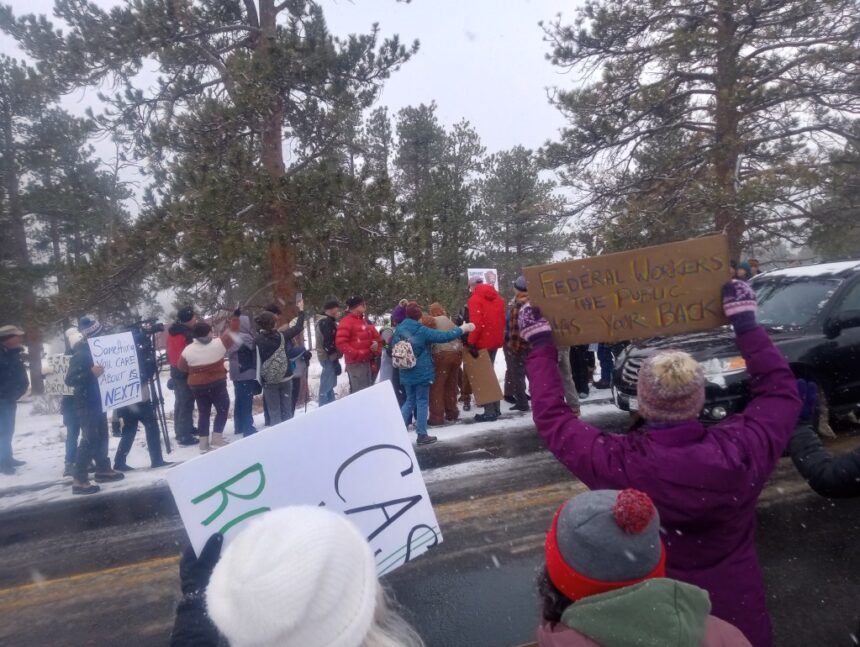 Protesters gather outside Rocky Mountain National Park to support federal workers