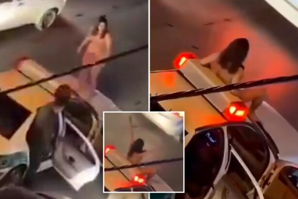 Video shows naked Iranian woman jumping on police car in protest at country's treatment of women