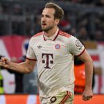 Kane makes history as Bayern book last-eight spot