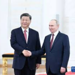China's Xi stands with Putin at Russia's Victory Day parade